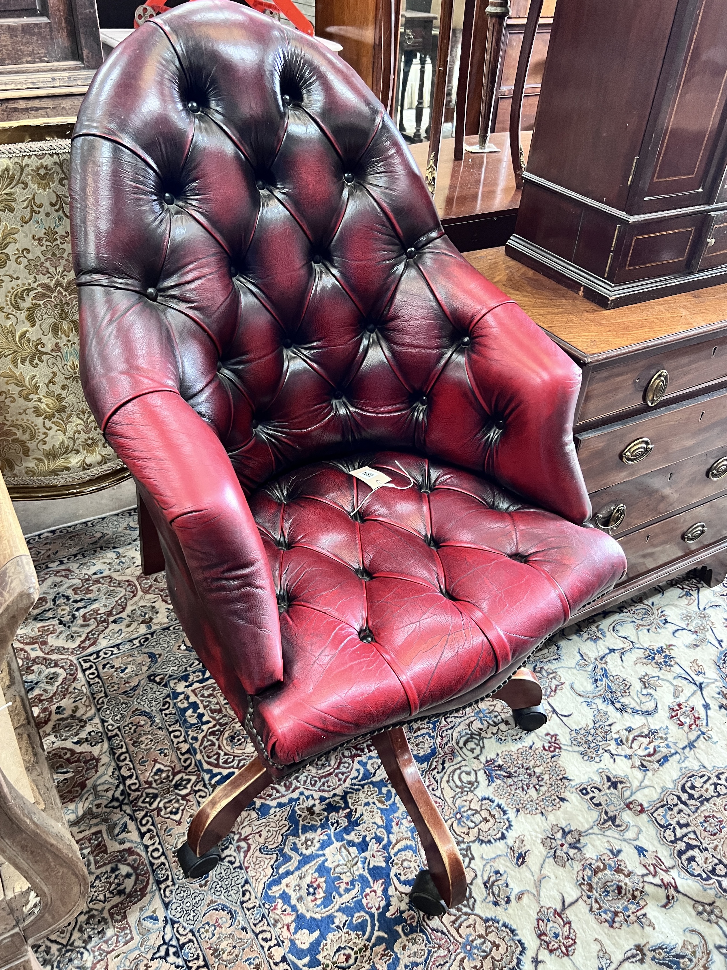 A Victorian style swivel desk chair, width 63cm, height 110cm